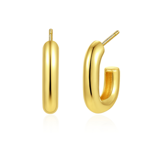 14K gold-plated minimalist oval hoop earrings from the Wealth Collection — polished chunky huggie hoops symbolizing timeless prosperity and understated elegance by Ploutos Jewellery.