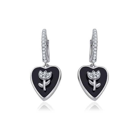 Ploutos Jewellery Bloom in Noir Earrings in 925 sterling silver — black onyx heart drop earrings with silver flower design from the Abundance Collection, symbolising strength, elegance, and quiet femininity.