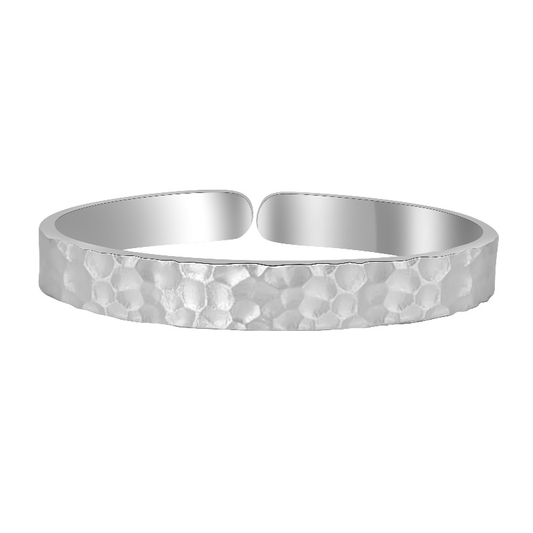 Ploutos Jewellery Ethereal Hammered Silver Bangle — handcrafted 999 fine silver open cuff bracelet featuring a soft organic hammered texture. From the Wealth Collection, symbolising quiet strength, resilience, and natural elegance.