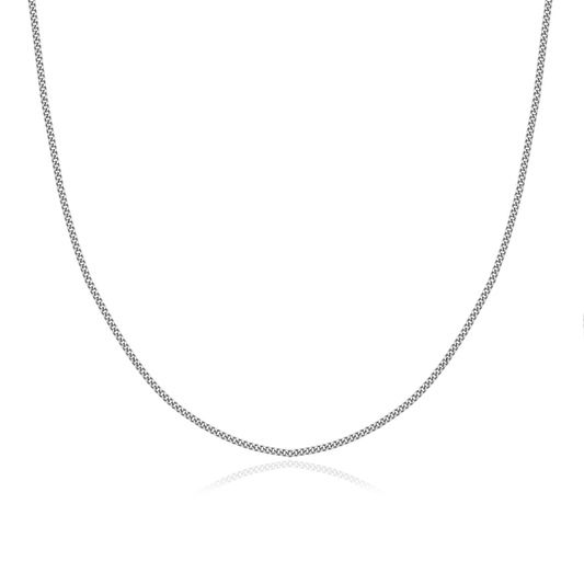 Lumis Curb Chain Necklace in 925 sterling silver — fine, closely linked curb design from the Abundance Collection by Ploutos Jewellery. Handcrafted for fluid movement, timeless elegance, and minimalist everyday layering.