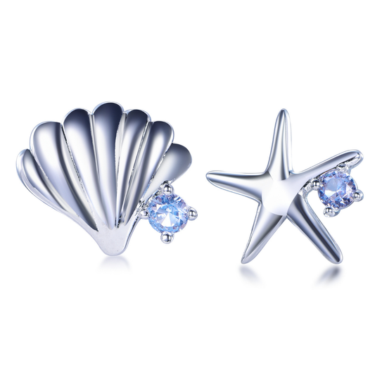 Rhodium-plated seashell and starfish mismatched stud earrings from the Cosmic Energy Collection — ocean-inspired design with sparkling cubic zirconia stones, elegant fine jewellery by Ploutos Jewellery.