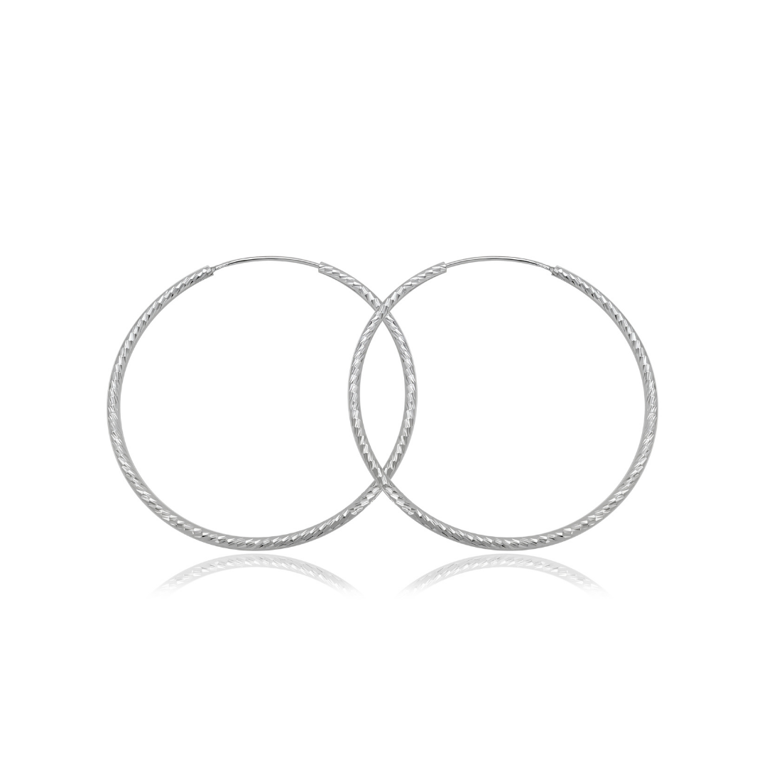 Ploutos Jewellery Eterna 50mm Twisted Silver Hoop Earrings — handcrafted 925 sterling silver hoops with elegant twisted texture, lightweight large silver earrings from the Abundance Collection symbolising modern sophistication and timeless confidence.