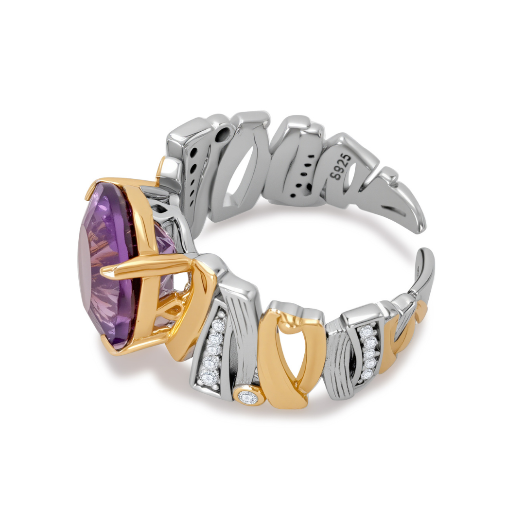 Side view of Ploutos Jewellery Eterna Amethyst Energy Ring — handcrafted 925 sterling silver ring with gold accents and a faceted purple amethyst centerpiece. Features intricate Italian-inspired band design with diamond details, symbolising balance, clarity, and spiritual strength from the Cosmic Energy Collection.