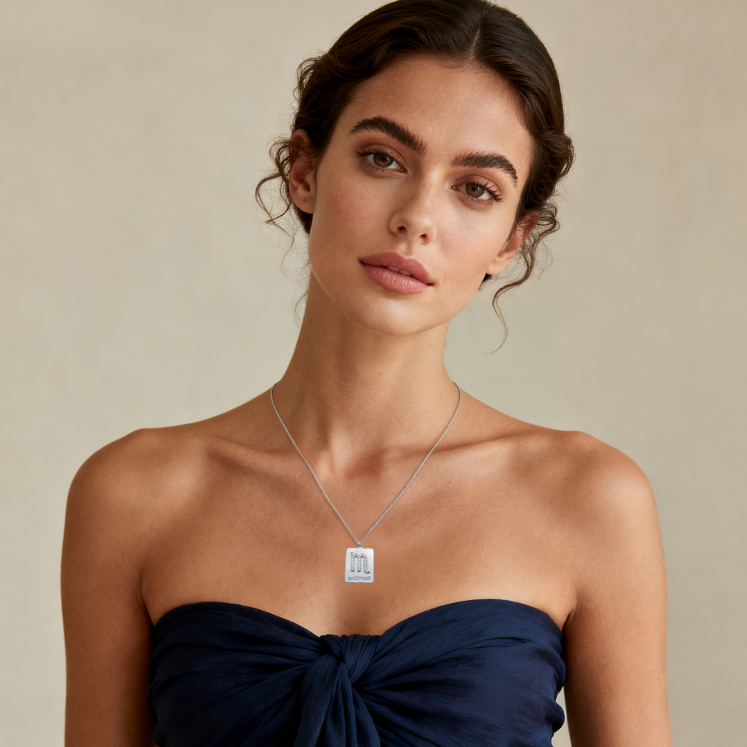 Model wearing Ploutos Jewellery Scorpio Zodiac Necklace in 925 sterling silver — minimalist astrology pendant from the Cosmic Energy Collection, featuring a sparkling cubic zirconia Scorpio symbol symbolising passion, intuition, and strength.