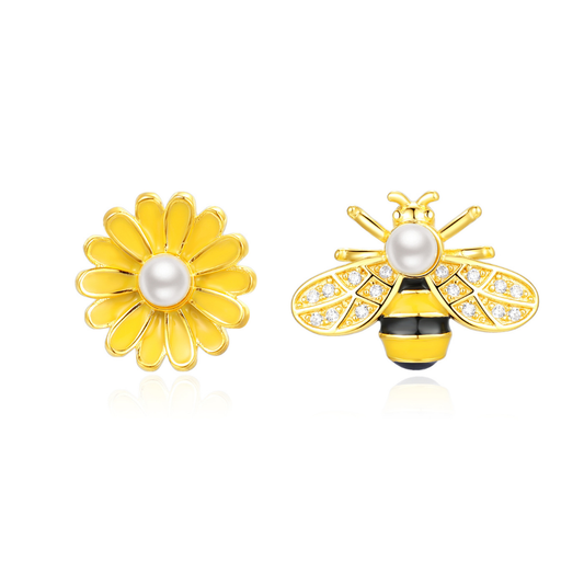 14K gold-plated mismatched daisy and bee stud earrings with shell pearls — playful yet elegant design from the Abundance Collection by Ploutos Jewellery, symbolizing growth, joy, and prosperity.