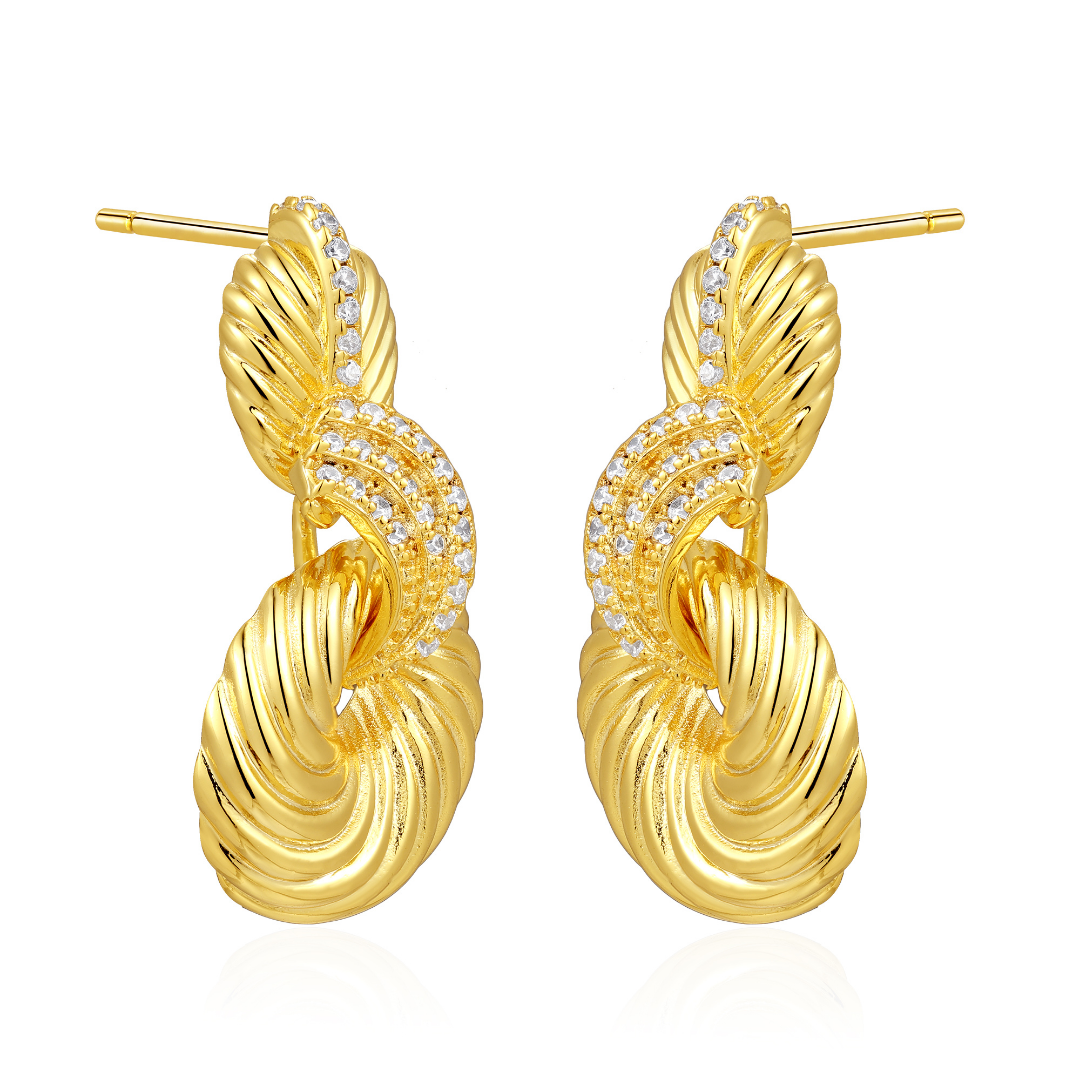 14K gold-plated spiral drop earrings with pavé zircon detailing from the Wealth Collection — bold luxury jewellery symbolizing prosperity and timeless sophistication, by Ploutos Jewellery.