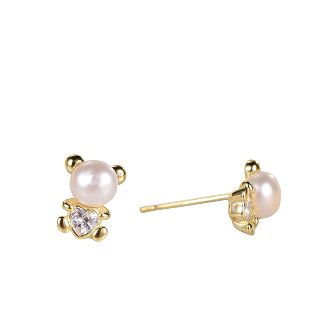 14K gold-plated teddy bear shell pearl stud earrings from the Abundance Collection — featuring luminous shell pearls and sparkling heart-shaped cubic zirconia, symbolizing playful charm and feminine abundance by Ploutos Jewellery.