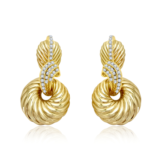 14K gold-plated twisted circle statement earrings from the Wealth Collection — luxurious spiral design with pavé zircon accents symbolizing abundance and timeless elegance, by Ploutos Jewellery.
