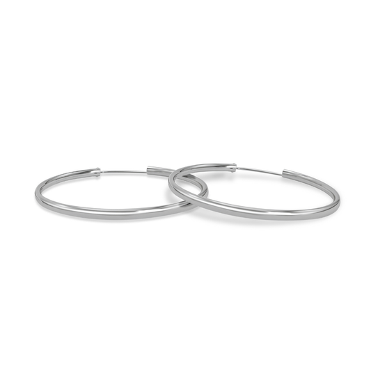 Ploutos Jewellery Astra 50mm Classic Smooth Silver Hoop Earrings — handcrafted 925 sterling silver large hoops with mirror-polished finish, minimalist design from the Abundance Collection symbolising timeless elegance and quiet confidence.