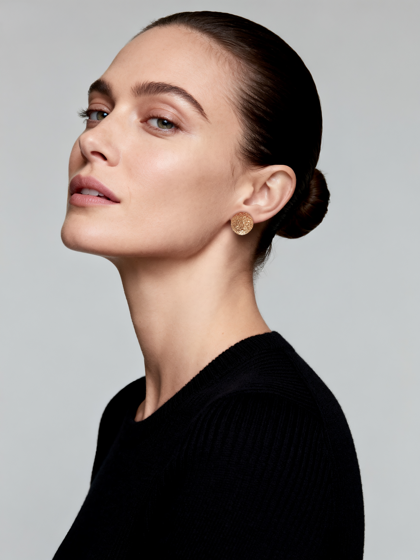 Model wearing Ploutos Jewellery Aurora Dome Gold Stud Earrings — 18k gold-plated recycled 925 sterling silver with a hand-textured dome design. Elegant and radiant, these earrings add warm golden sophistication and modern confidence to any look.