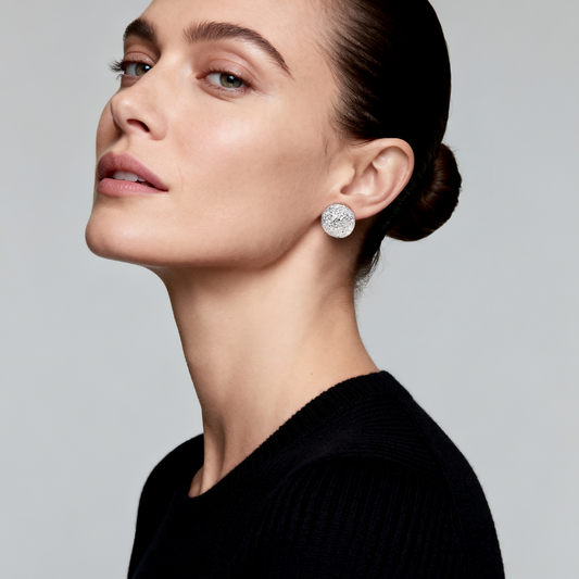 Model wearing Ploutos Jewellery Aurora Dome Silver Stud Earrings — handcrafted 925 sterling silver with hand-textured dome design. Elegant minimalist silver studs that radiate soft luminosity and modern sophistication, perfect for everyday luxury style.