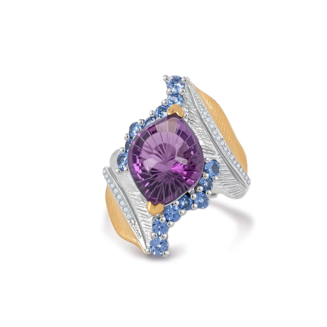 Ploutos Jewellery Celestia Feather Amethyst & Topaz Ring — handcrafted 925 sterling silver ring with gold accents, featuring a cushion-cut purple amethyst surrounded by sky-blue topaz gemstones. A statement piece from the Cosmic Energy Collection symbolising peace, freedom, and spiritual strength through exquisite Italian craftsmanship. 