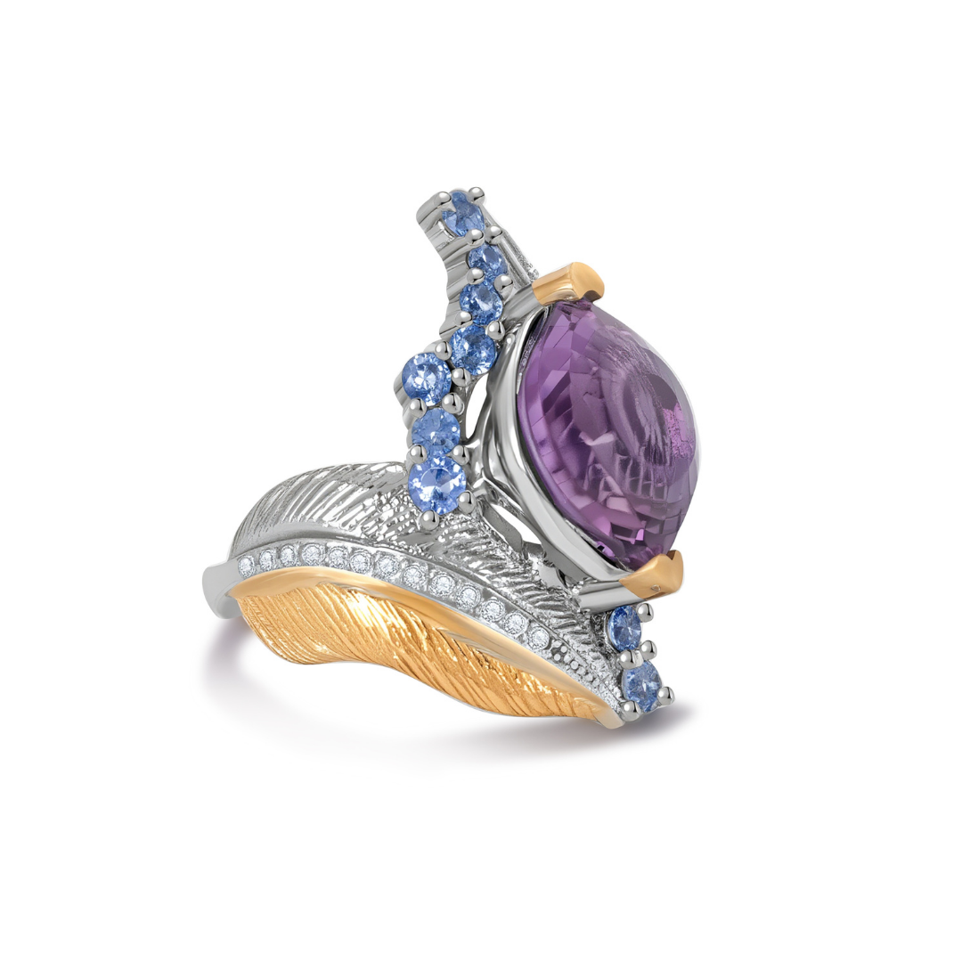 Side view of Ploutos Jewellery Celestia Feather Amethyst & Topaz Ring — luxurious handcrafted 925 sterling silver ring with gold feather detailing, featuring a cushion-cut purple amethyst surrounded by sky-blue topaz gemstones. A sculptural design from the Cosmic Energy Collection symbolising intuition, serenity, and inner freedom.