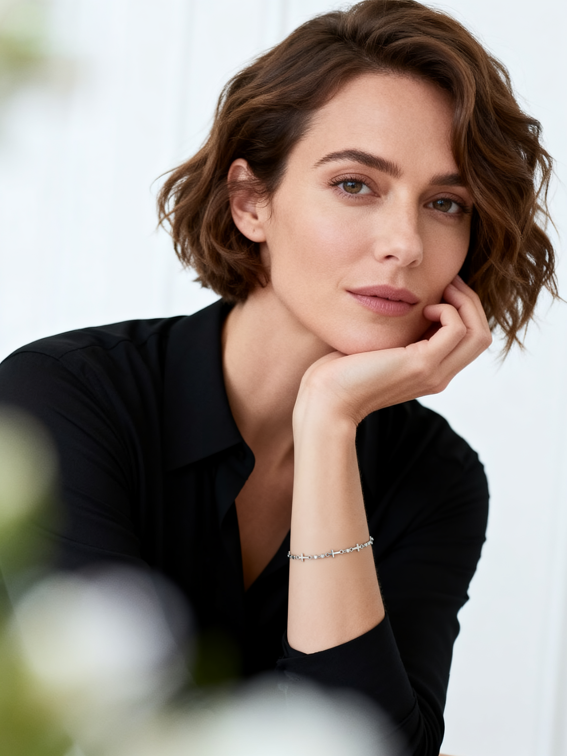 Model wearing Ploutos Jewellery Celestial Cross Silver Bracelet — minimalist 925 sterling silver bracelet with cross and zircon details. Elegant fine jewellery symbolising light, faith, and inner harmony from the Cosmic Energy Collection.