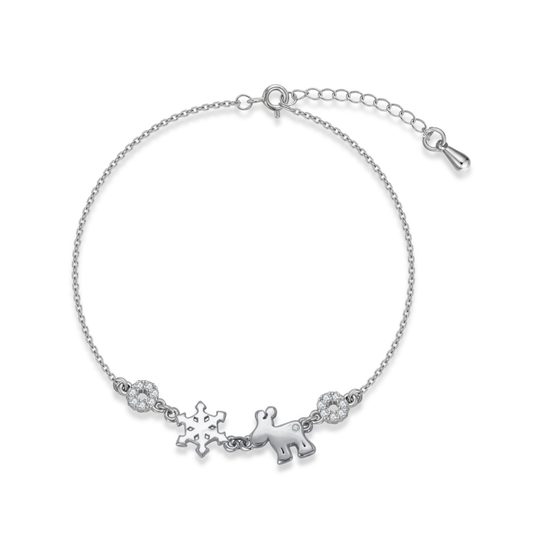 Ploutos Jewellery Christmas Bracelet — handcrafted 925 sterling silver bracelet with snowflake and reindeer charms, symbolising joy, purity, and festive togetherness. Accented with sparkling cubic zirconia stones for a touch of holiday elegance from the Abundance Collection.