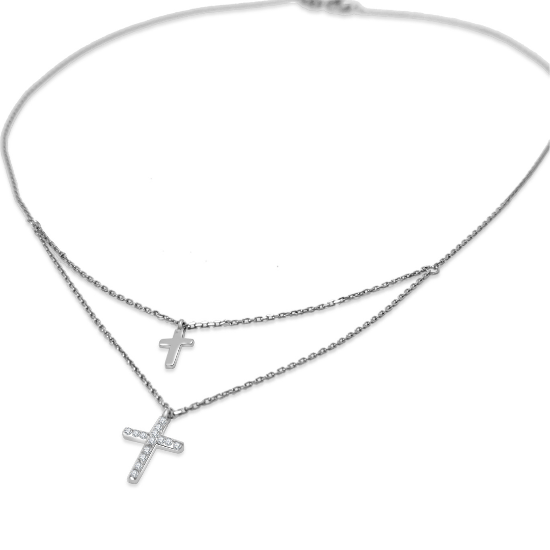 Ploutos Jewellery Divine Grace Layered Cross Necklace — handcrafted from recycled 925 sterling silver with a double-cross pendant design symbolizing protection, serenity, and spiritual energy. A minimalist cosmic energy piece blending timeless faith with modern elegance
