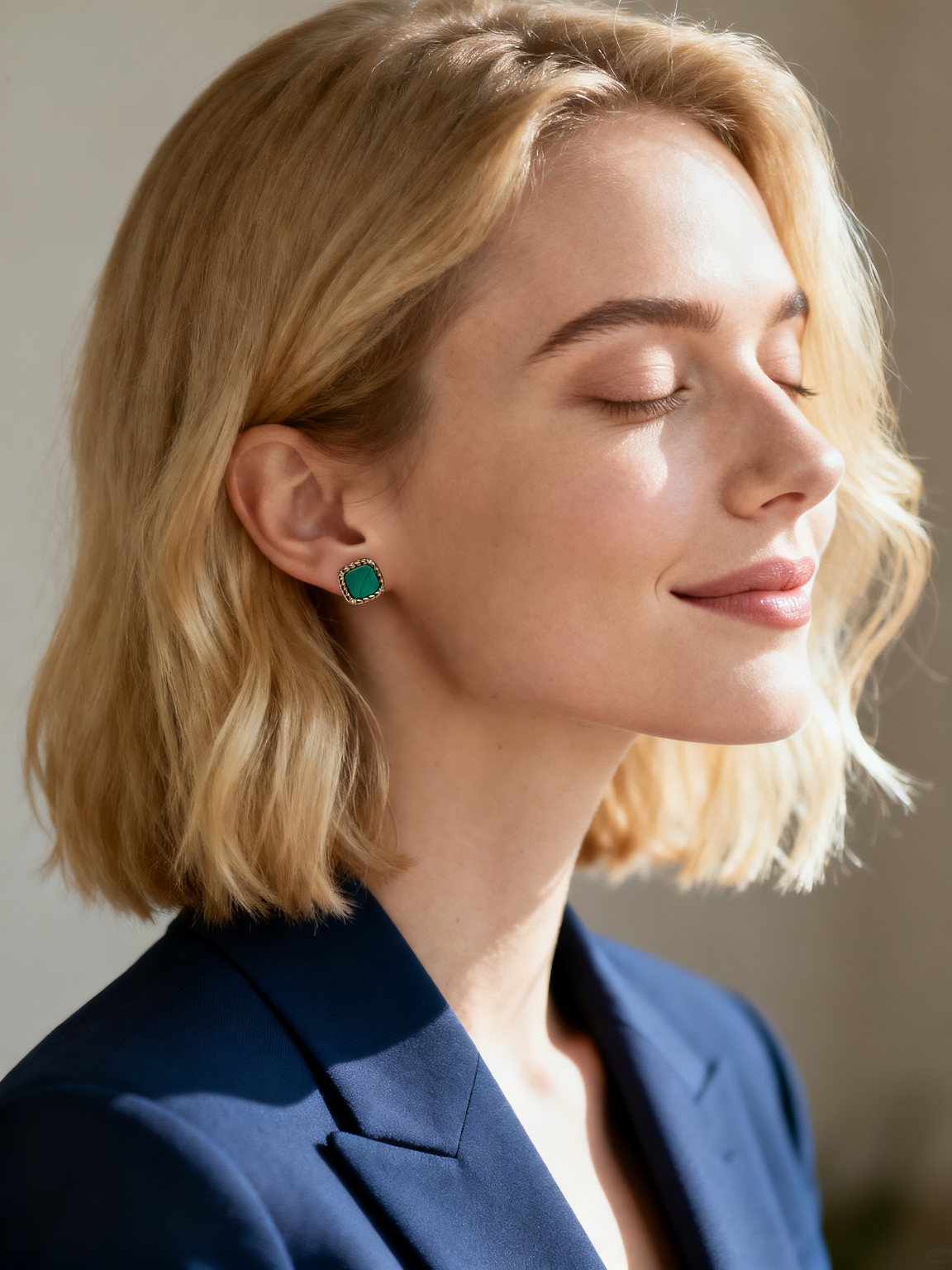Model wearing Ploutos Jewellery Emerald Crest Malachite Gold Stud Earrings — elegant 18K gold-plated sterling silver earrings with square green malachite gemstones and subtle cubic zirconia accents. A sophisticated piece from the Cosmic Energy Collection symbolizing renewal, harmony, and modern confidence.