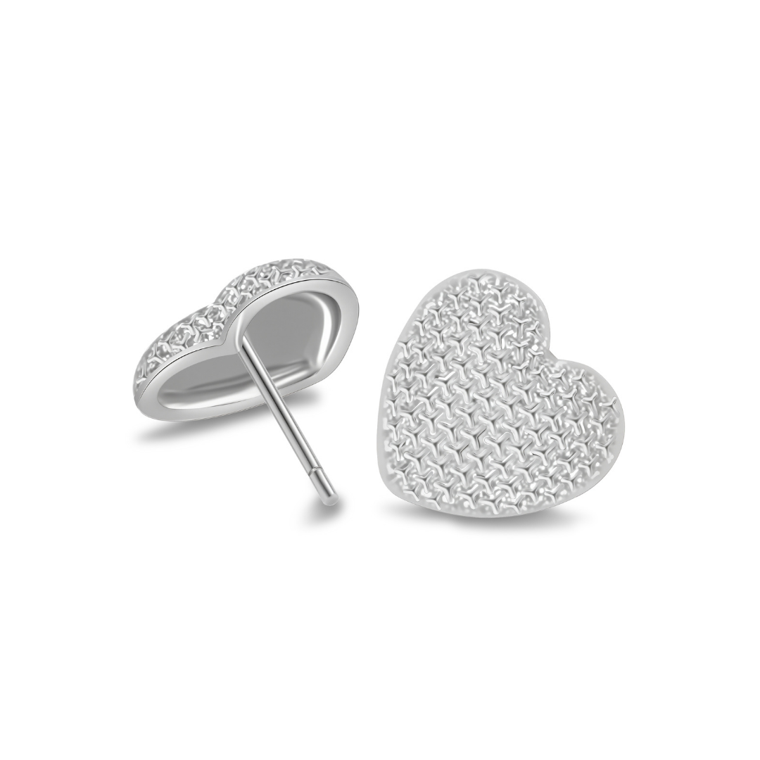 Close-up of Ploutos Jewellery Eternal Heart Silver Stud Earrings — rhodium-plated recycled 925 sterling silver with textured heart design. From the Abundance Collection, showcasing refined craftsmanship and elegant minimalist detailing.