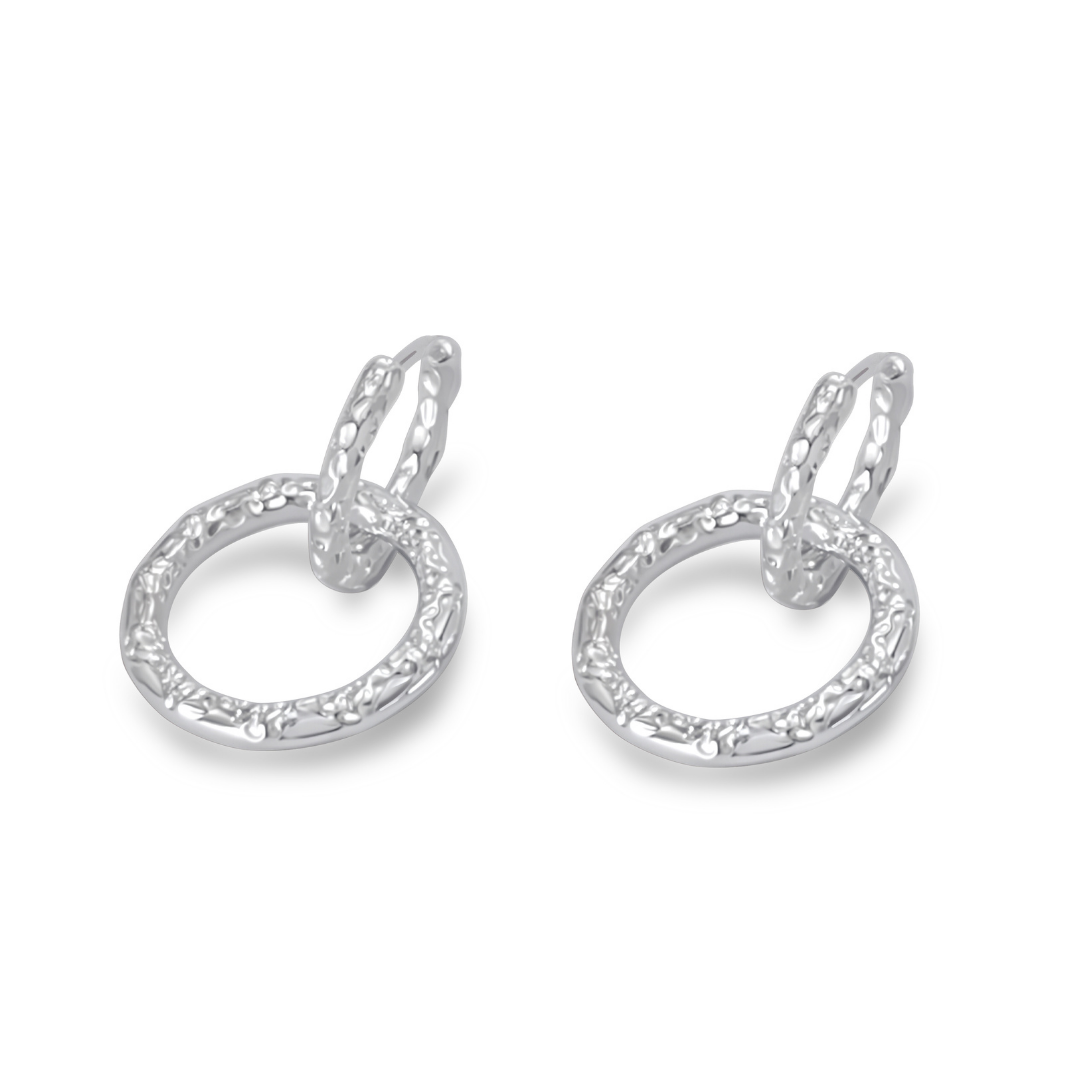 Ploutos Jewellery Luna Duality Silver Earrings — handcrafted from recycled 925 sterling silver with a textured circular drop design. These versatile earrings from the Abundance Collection can be worn as detachable hoops or minimalist studs, reflecting moonlit elegance and modern versatility for everyday luxury