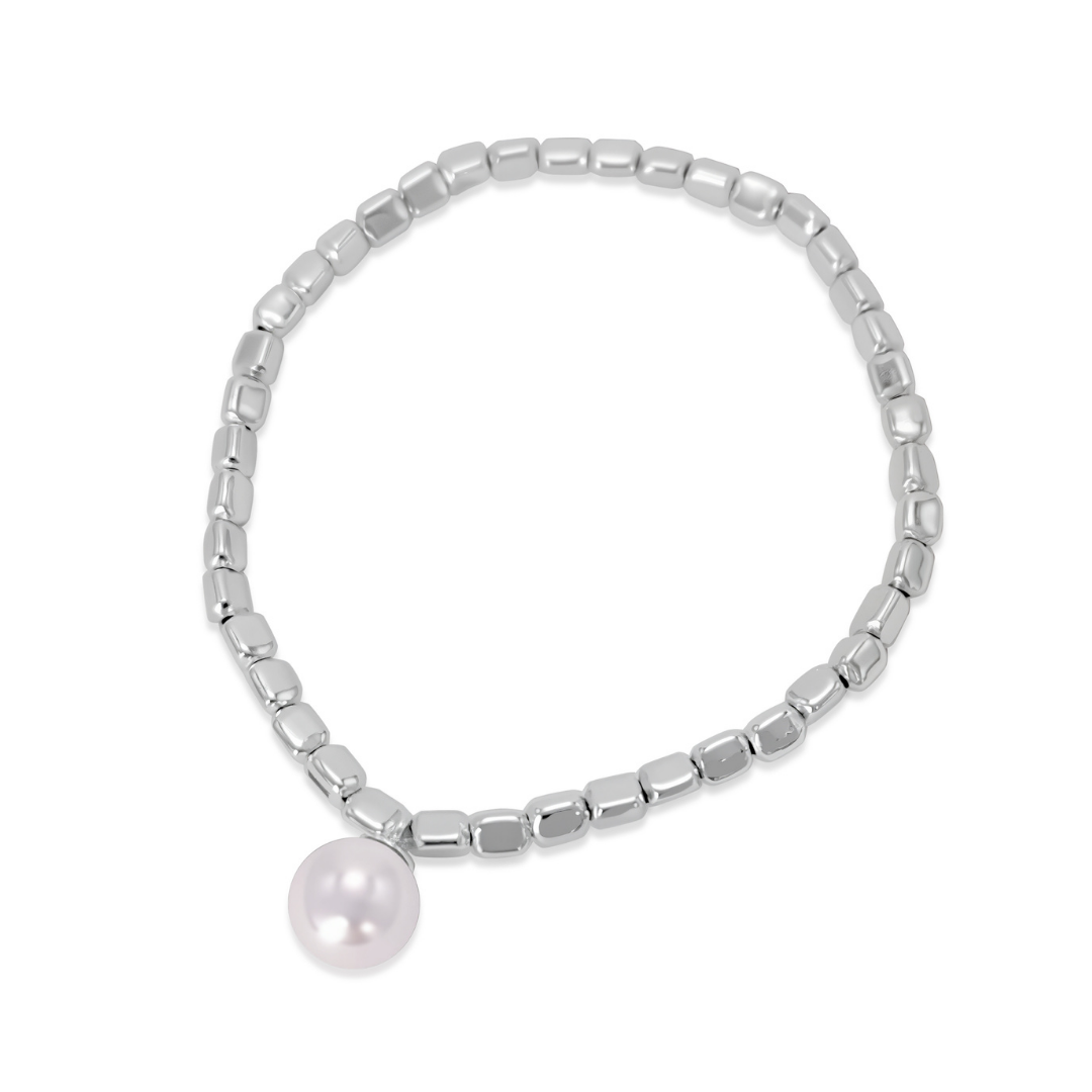 Ploutos Jewellery Luna Pearl Silver Bracelet — handcrafted from 990 pure silver with a luminous natural shell pearl charm. Elegant elastic beaded bracelet symbolising femininity, wealth, and inner calm. A timeless piece from the Wealth Collection, designed for effortless sophistication and everyday luxury.