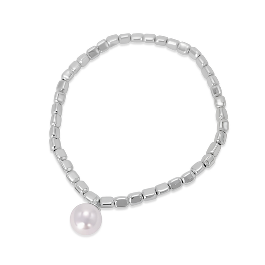 Ploutos Jewellery Luna Pearl Silver Bracelet — handcrafted from 990 pure silver with a luminous natural shell pearl charm. Elegant elastic beaded bracelet symbolising femininity, wealth, and inner calm. A timeless piece from the Wealth Collection, designed for effortless sophistication and everyday luxury.
