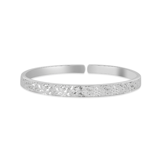 Ploutos Jewellery Radiance Silver Bangle — handcrafted 999 fine silver open cuff bracelet with subtle hammered texture. From the Wealth Collection, symbolising inner peace, balance, and quiet strength with a natural reflective shine.