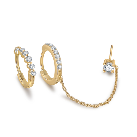 Ploutos Jewellery Radiant Chain Gold Huggie Earrings — 14K gold-plated recycled 925 sterling silver double-hoop design with cubic zirconia and delicate connecting chain. From the Abundance Collection, these elegant yet modern earrings embody luminous sophistication and versatile styling for women with radiant confidence.