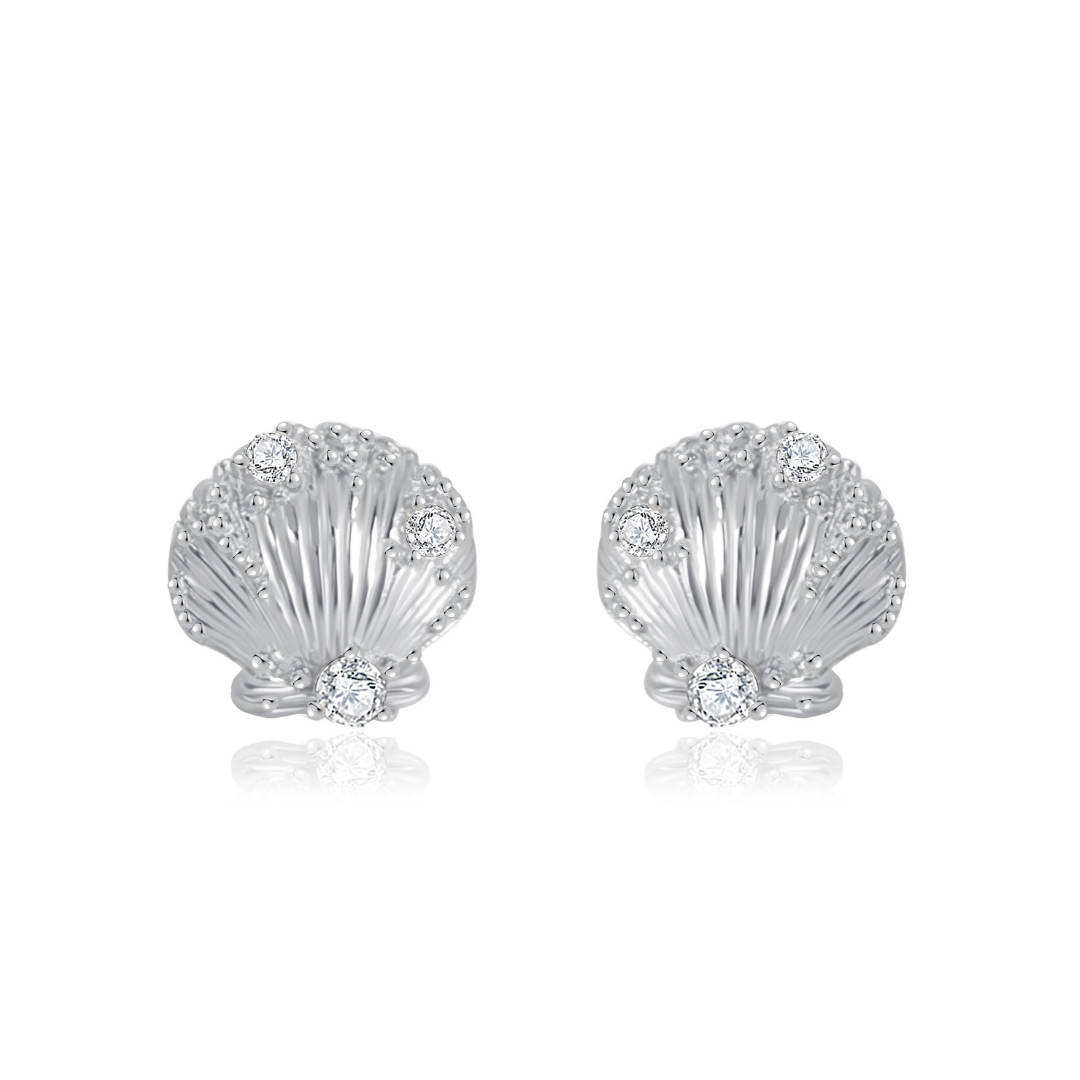 Ploutos Jewellery Seaside Glow Silver Shell Earrings — handcrafted from recycled 925 sterling silver, featuring delicate shell-inspired details adorned with sparkling cubic zirconia. These ocean-themed stud earrings capture the luminous shimmer of moonlight on water, symbolizing serenity, grace, and natural abundance. From the Abundance Collection.