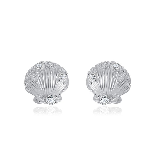 Ploutos Jewellery Seaside Glow Silver Shell Earrings — handcrafted from recycled 925 sterling silver, featuring delicate shell-inspired details adorned with sparkling cubic zirconia. These ocean-themed stud earrings capture the luminous shimmer of moonlight on water, symbolizing serenity, grace, and natural abundance. From the Abundance Collection.