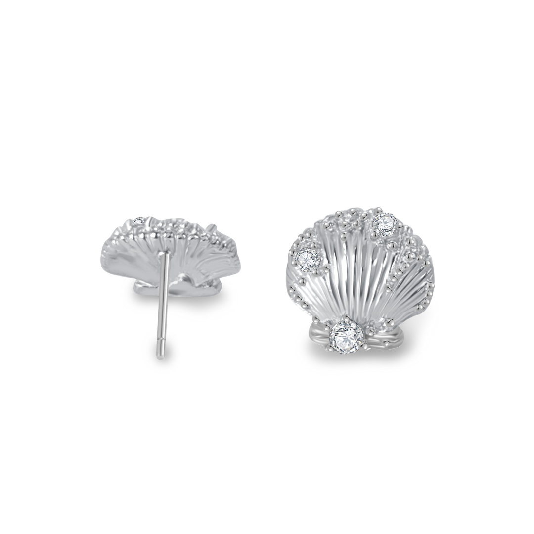 Ploutos Jewellery Seaside Glow Silver Shell Earrings — side and front view of handcrafted 925 sterling silver shell studs adorned with sparkling cubic zirconia. Ocean-inspired design symbolizing calm and abundance, from the Abundance Collection by Ploutos Jewellery.