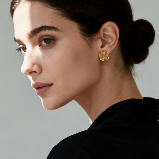 Model wearing Ploutos Jewellery Starlight Trail Gold Stud Earrings — 18k gold-plated 925 sterling silver with hand-textured surface and sparkling cubic zirconia shooting star design. Celestial-inspired earrings radiating cosmic elegance and modern sophistication.