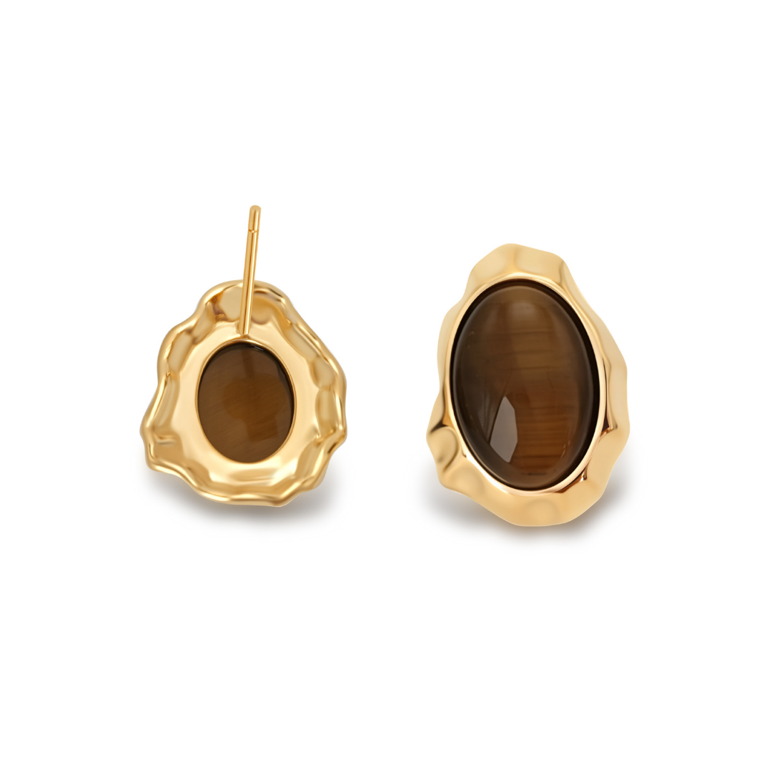 Ploutos Jewellery Tiger’s Eye Guardian Stud Earrings — 18K gold-plated recycled 925 sterling silver earrings featuring polished oval Tiger’s Eye gemstones in molten wave-inspired frames. The rich golden-brown stones radiate grounding energy, symbolizing protection, balance, and inner strength. A statement piece from the Cosmic Energy Collection.