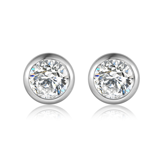 Ploutos Jewellery Timeless Sparkle Zircon Stud Earrings — minimalist round studs handcrafted in recycled 925 sterling silver, featuring high-grade cubic zirconia that reflects diamond-like brilliance. Elegant, lightweight, and versatile earrings from the Abundance Collection, symbolising grace and confidence.