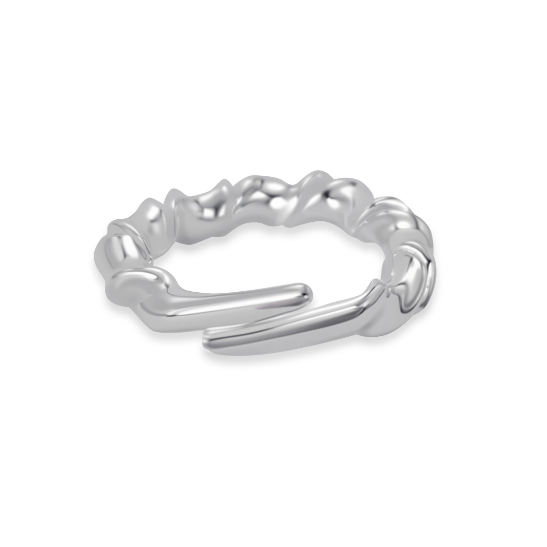 Ploutos Jewellery Waveform Adjustable Silver Ring — a sculptural 925 sterling silver open ring with fluid, ocean-inspired curves. Handcrafted from recycled silver, this contemporary design captures the rhythm of waves and symbolizes calm balance and modern minimalism. A signature piece from the Abundance Collection.